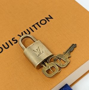 Louis Vuitton keys and lock gold authentic
